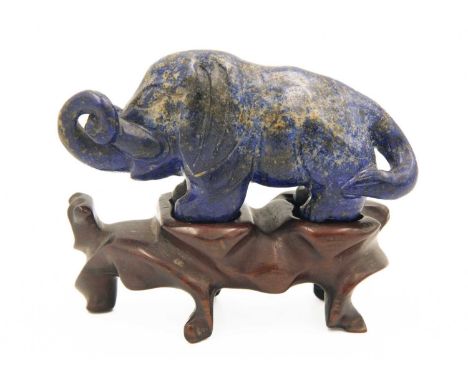 A Chinese lapis lazuli model of an elephant on stand, Qing Dynasty, 19th century. Height of elephant 3.5cm, length 8cm, depth