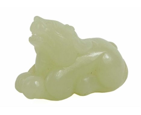 A Chinese jade Pixiu, late Qing Dynasty. With slight russet inclusion, height 2.5cm, width 4cm, depth 1.5cm.This fine carving