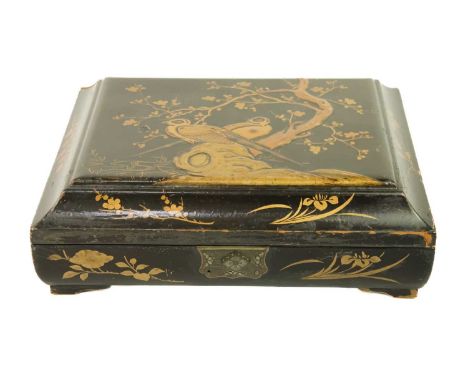 A Chinese black lacquered gilt decorated games box, early 20th century. The cover decorated with birds perched on a rock bene