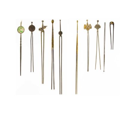 A Japanese iron hairpin, signed, Edo period. With gold inlay, length 8.5cm; a Japanese white metal and carved jade kanzashi, 