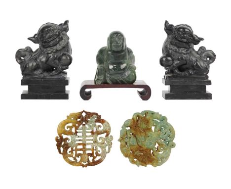 A Chinese jadeite model of Buddha. Height 8cm, on a wooden stand; two bi discs, diameter 6.5cm; and a pair of fo dogs, height