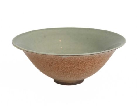 A Chinese celadon glazed tea bowl, Height 3.3cm, diameter 9cm.The Vandekar family established their internationally renowned 