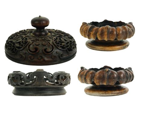 A Chinese carved wood vase cover, late 19th/early 20th century. Height 7cm, diameter 12cm, a pair of Chinese carved wood vase