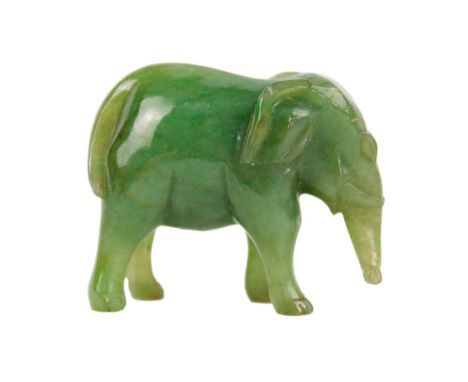 A Chinese spinach jade model of an elephant, late Qing Dynasty. Height 3.5cm, length 4.5cm, depth 1.5cm.The vendor inherited 