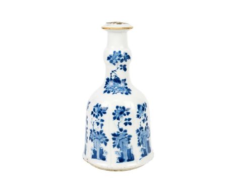 A Chinese blue and white hookah base, Kangxi, 1662-1722. The bell-shaped body painted with leafy branches and stylised flower