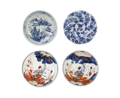 Two similar Chinese porcelain saucer dishes, 18th century. Height 3cm, diameter 13.5cm, a Chinese blue and white porcelain fl