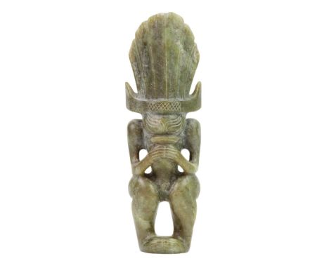 A Chinese carved jade model of an ancient style mythical creature. Height 23cm, width 7.5cm, depth 4.5cm.