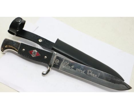 A replica Third Reich Hitler Youth dagger, with enamelled badge to the chequered grip and metal scabbard. UK P&amp;P Group 1 