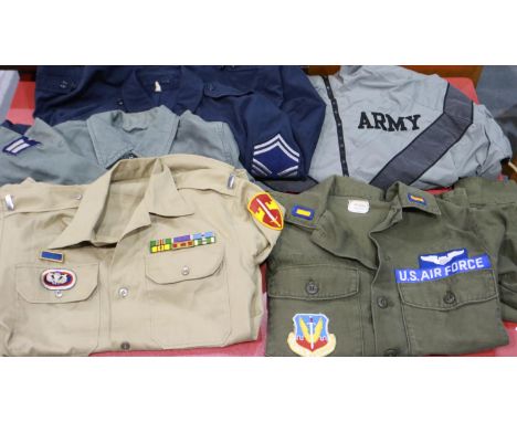 US military uniform shirts and coats, including examples marked USMC and US Army, most 1970s-90s, some named with insignia. U
