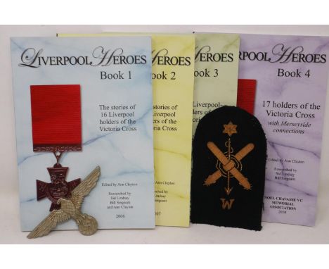 Third Reich pressed metal kepi eagle, a naval division patch, and books 1-4 of Liverpool Heroes, published by the Noel Chavas