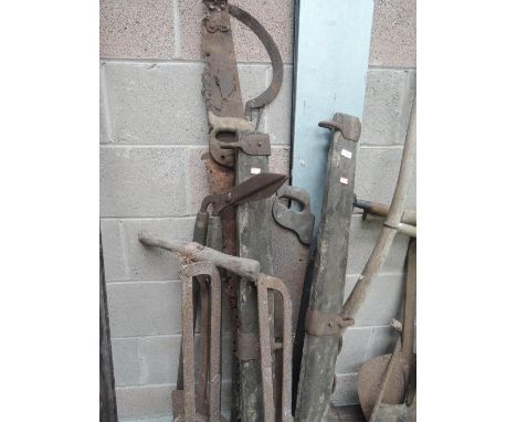 A selection of vintage farm implements and tools