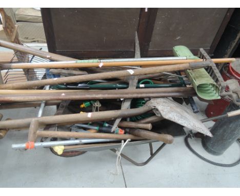 A selection of gardening tools and similar including galvanised wheel barrow