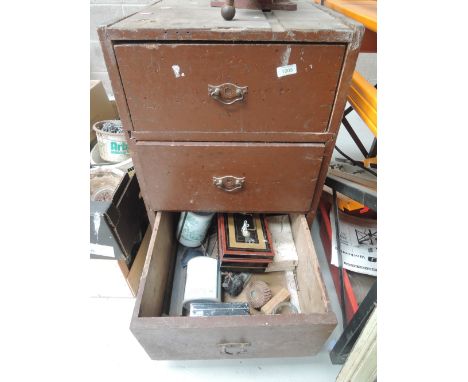A chest of three over drawers with tools and contents