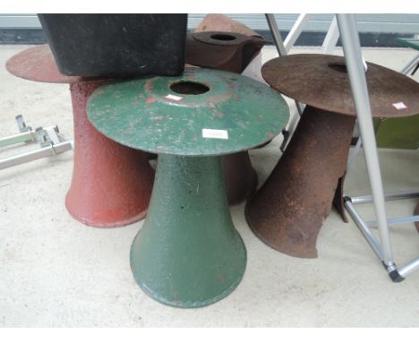 A set of four cast iron stands or garden seats or Staddle props