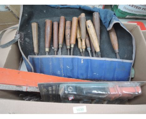 A selection of tools including selection of wood carving and similar chisels
