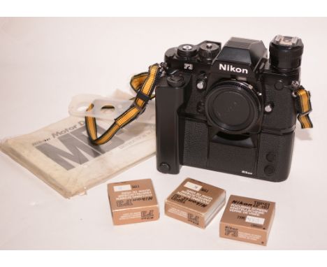 A Nikon F3 SLR 35mm camera fitted MD-4 motor drive; together with three focusing screens and instruction manuals.