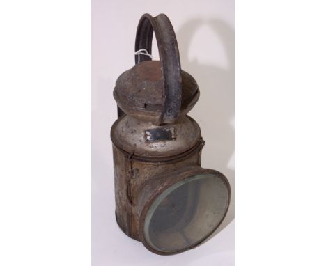 An unmarked railway lamp with clear red and blue interior liners, 31cms high.