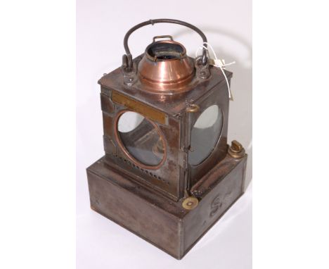 An LNER lamp manufacturing and railway supplies Welch patent lantern type lamp with copper chimney, 23cms high.