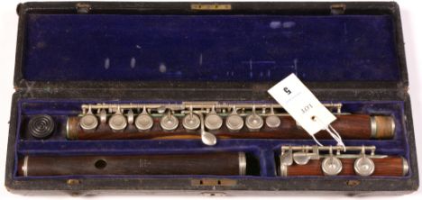An Isidor Lot B&amp;S model L rosewood flute fitted with German silver keys and mounts, 66cms in length in fitted leather cov