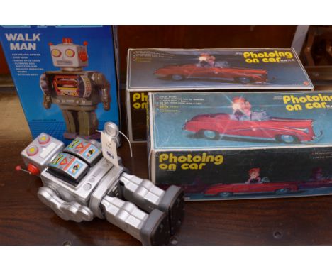 A Space Walk Man tinplate robot, Made in China, boxed; together with two Fotoing On Car toys, Made in China, both boxed.