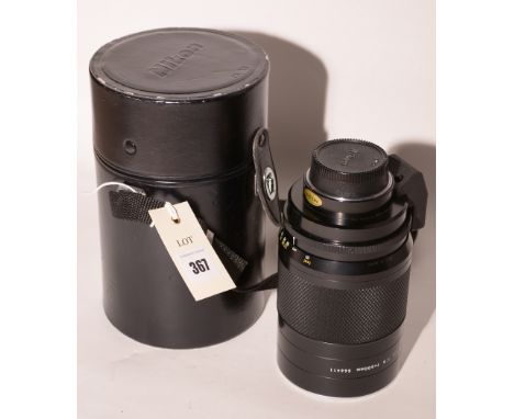 A Nikkor 500mm reflex lens, manual focus for F-series Nikon film cameras, in original case.