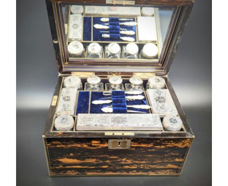 A Victorian traveling coromandel wood vanity case, fitted with silver topped glass containers, hallmarked London, 1862, the t