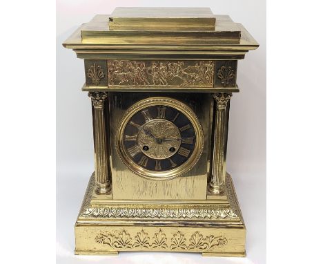 An early 20th century French brass mantel clock, Grecian style frieze, Corinthian column supports, Anthemion appliques, 8 day