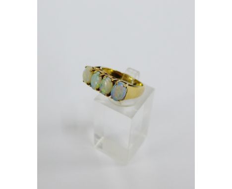 9 carat gold opal four stone claw set dress ring, London 1975, UK ring size M