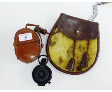 Browne &amp; Son marching compass, numbered 63004A, in leather case together with a brown leather and sealskin sporran (2) 