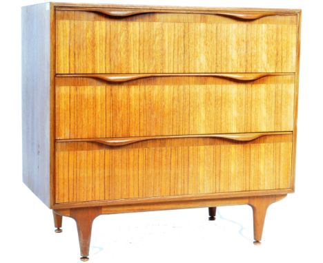 Austin Suite - A stylish retro vintage 20th Century teak wood upright pedestal chest of drawers having three deep straight dr