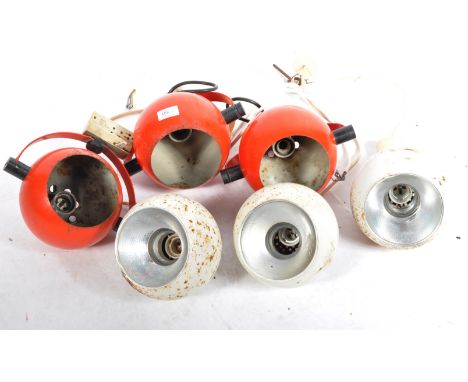 A collection of retro vintage 20th Century eyeball ceiling lights / lamps comprising a set of three red enamel coated example