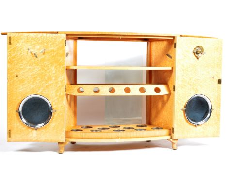 An early 20th Century vintage Art Deco birdseye maple cocktail cabinet drinks bar by Turnidge Of London having a flip open to