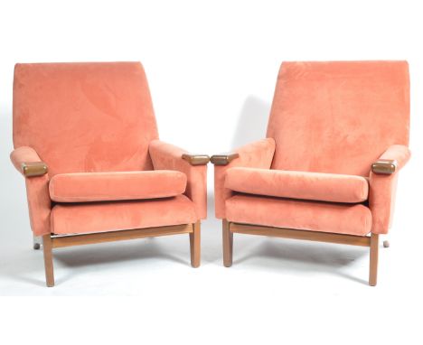 A matching pair of retro vintage 20th Century Danish Influence teak wood armchairs / easy lounge chairs with each being reuph