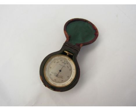 An Aitchinson &amp; Co. pocket compass/barometer in leather case