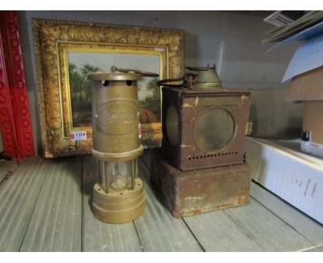 An Aberaman Colliery miner's lamp and a railway signal lamp interior, brass burner, stamped LMS