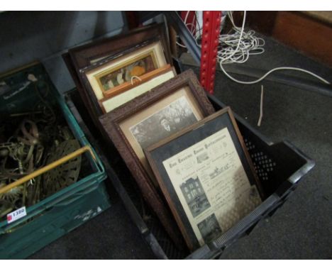 A box of framed prints and photographs