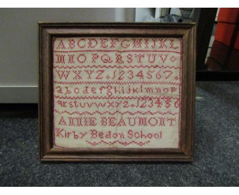 A 19th Century sampler in red "Kirby Bedon" Annie Beaumont