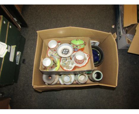 A selection of ceramics including ginger jars, eastern tea cups, saucers etc. together with two Clarice Cliff vases a/f 