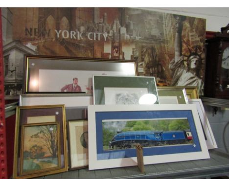 A collection of prints and photographs to include trains, large New York canvas, etc