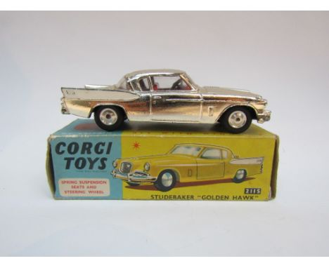 A boxed diecast Corgi 211S Studebaker "Golden Hawk", gold plated body with white flashes, red interior