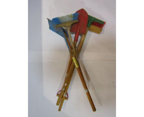 A set of "Brio" childs tools; rake, shovel, spade, broom and a similar childs broom (5)      