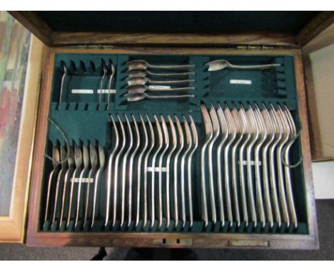An Elkington part canteen of cutlery incldung ladle, oak cased