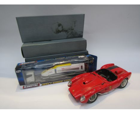 A Burago 1/18 scale diecast Ferrari Testa Rossa, a boxed Teamsterz diecast Heavy Engine Transporter and four Atlas Editions m