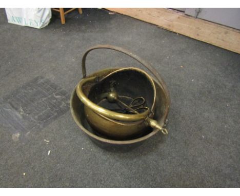 A brass jam pan, coal bucket and fire tools
