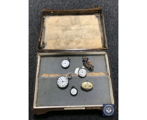 Four silver pocket/fob watches, an enamel pill box and a scent bottle, in a beech cutlery box