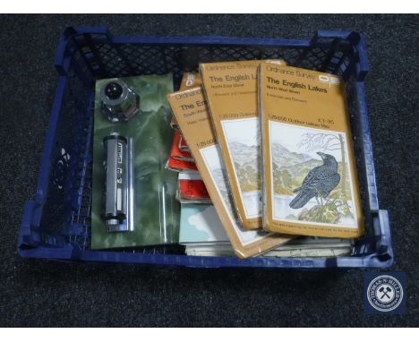 A basket of ordnance survey maps and an onyx desk stand 