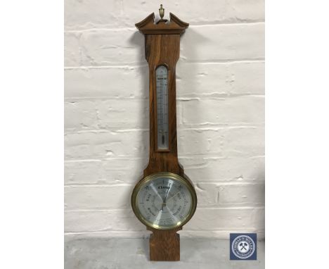 A Comitti of London walnut cased barometer
