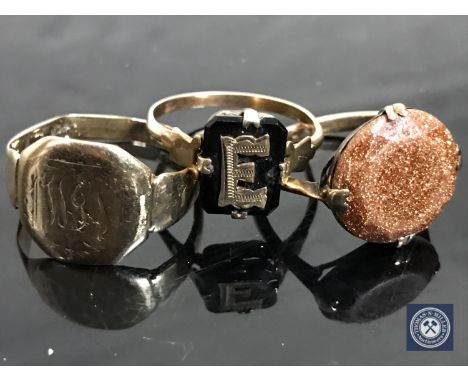 A gent's 9ct gold signet ring (a/f) together with two other yellow metal rings CONDITION REPORT: 7.0g gross
