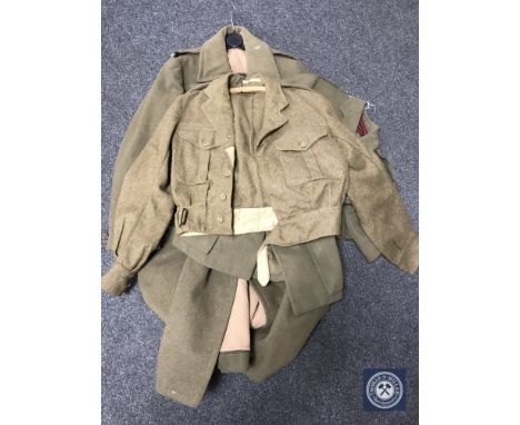 A WWII officer's trench coat and jacket together with one other military coat