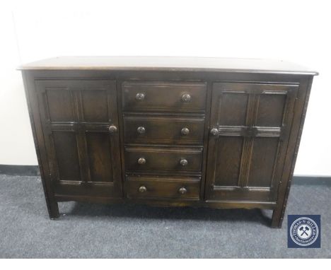A stained Ercol elm sideboard 